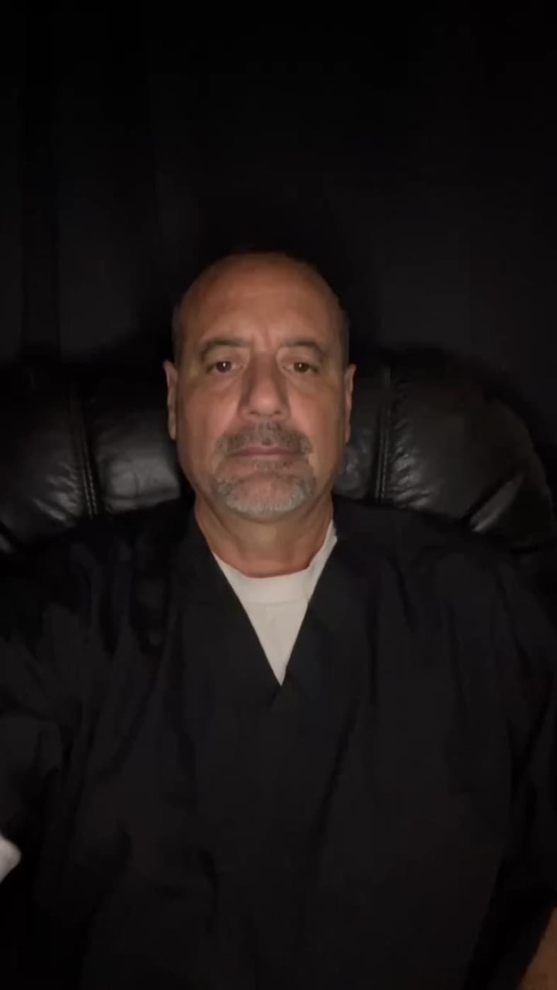 An Insta GQ client recording a video review from his living room